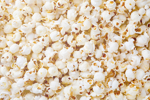 Homemade popcorn filled with spices and grains. Perfect snack for movie days at home.