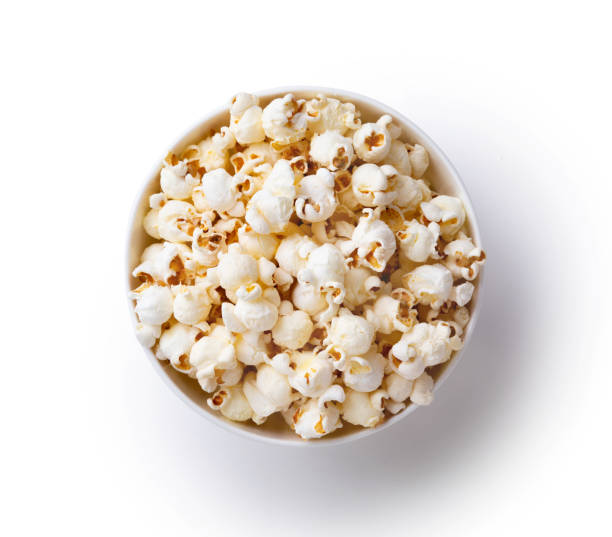 A bowl of popcorn isolated on white A bowl of popcorn isolated on white popcorn snack bowl isolated stock pictures, royalty-free photos & images