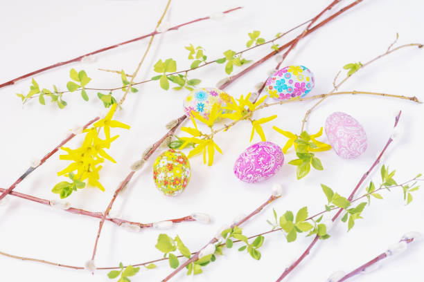 Pastel delicate background with Easter chocolate eggs, flowers, Pussy Willow Branches, flat lay. Spring holiday concept Pastel delicate background with Easter chocolate eggs, flowers, Pussy Willow Branches, flat lay, soft focus. Spring holiday concept bud candy stock pictures, royalty-free photos & images