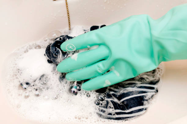 istock hand in a rubber glove washes clothing 1314630065