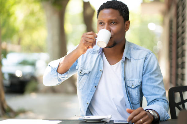 istock Man drinking coffee at coffee shop. 1314630404