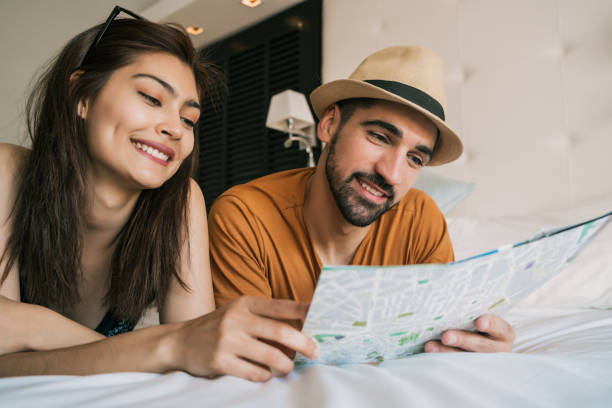 istock Couple organizing their trip at hotel room. 1314631348