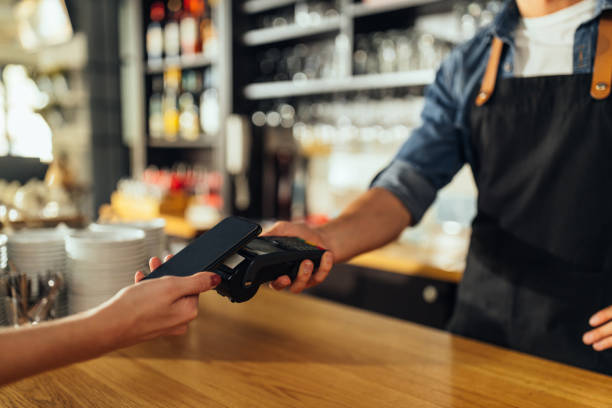 istock Woman paying with mobile a take away order 1314634014