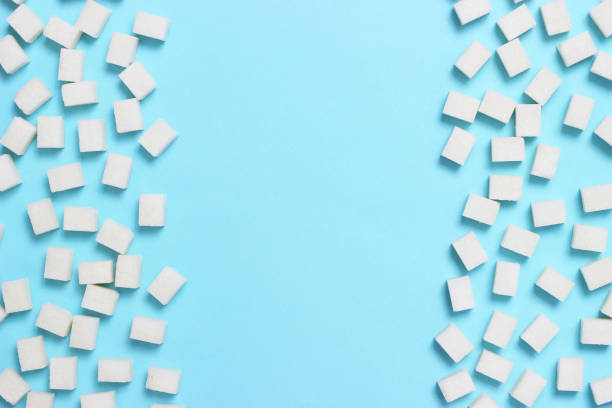 istock Refined sugar on a colored background. Diabetes concept, excess sugar 1314635163