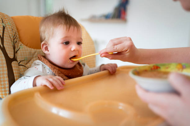 istock Baby boy eating at home 1314636501
