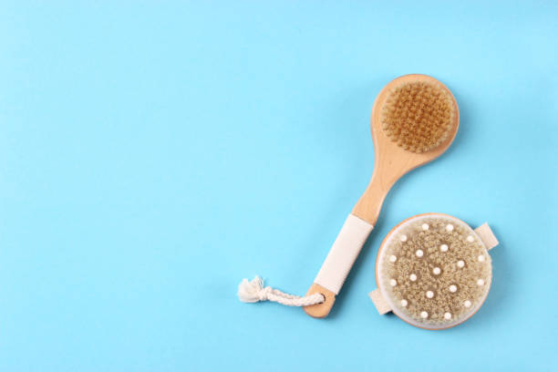 istock brush for dry massage on a colored background top view. 1314636939