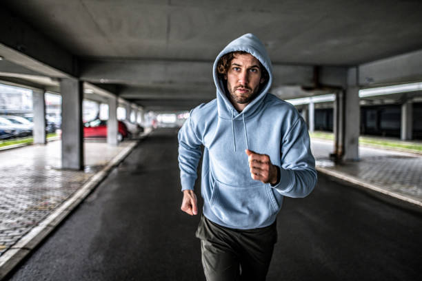 istock Young sportsman running under the bridge. 1314638844