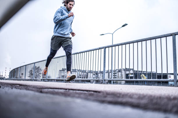 istock Young sportsman running on the bridge. 1314639746