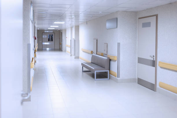 istock Light hospital corridor with white doors closeup 1314642793