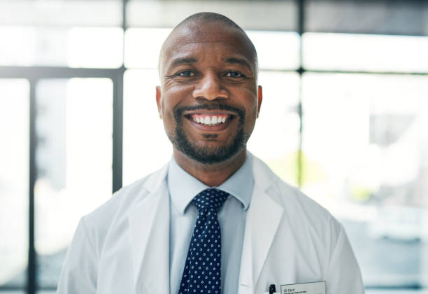 Cropped portrait of a handsome mature male doctor standing in the hospital Saving lives always puts a smile on my face hospital card stock pictures, royalty-free photos & images