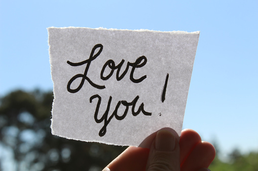 Cursive hand written love you note