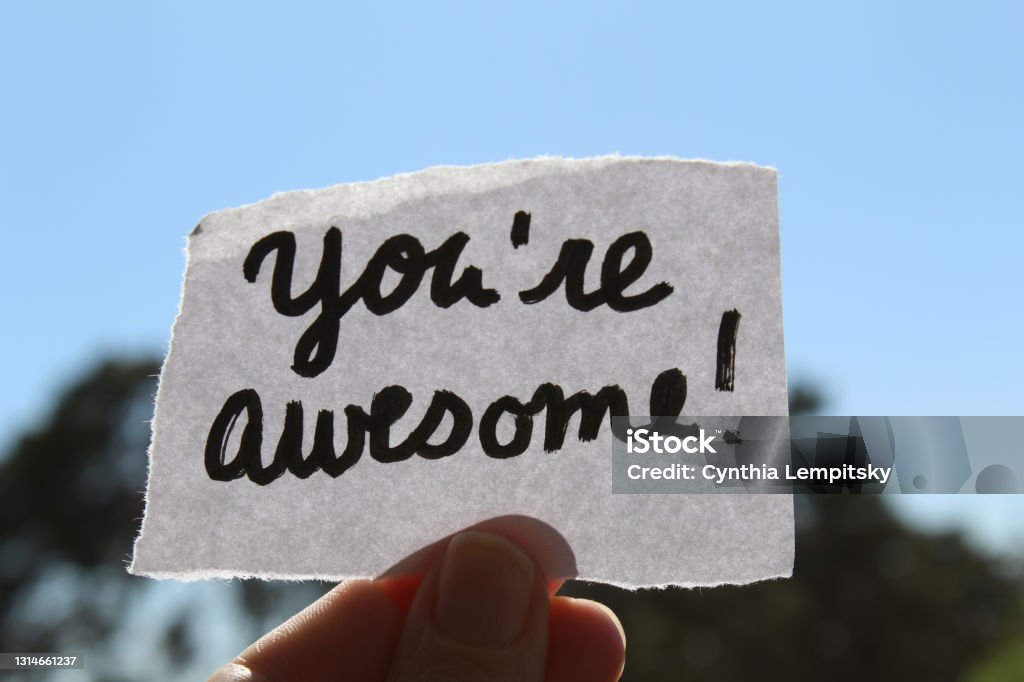 Hand written note that says you're awesome Uplifting positive hand written you are awesome note Awe Stock Photo