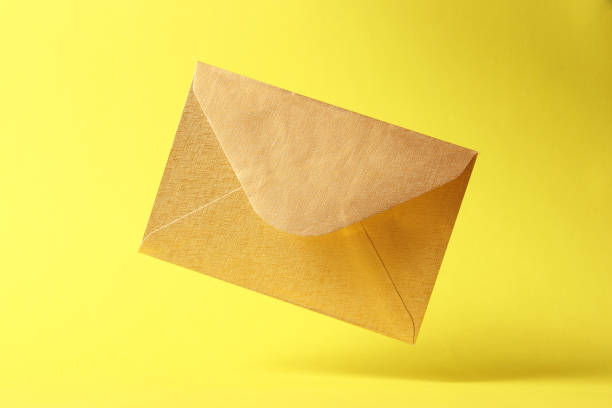 istock The envelope falls to the ground on a colored background. 1314662328