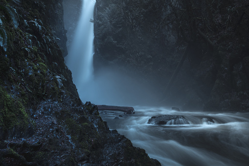 Misty waterfall in low light at Goldstream Provincial park on southern Vancouver Island.