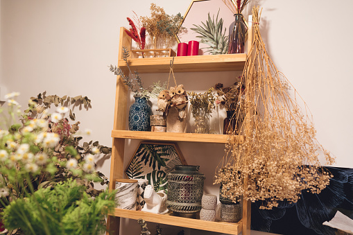 Decorative items on a shelf belonging to a professional florist
