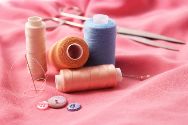 istock Set of different sewing accessories on a colored background close-up 1314671912