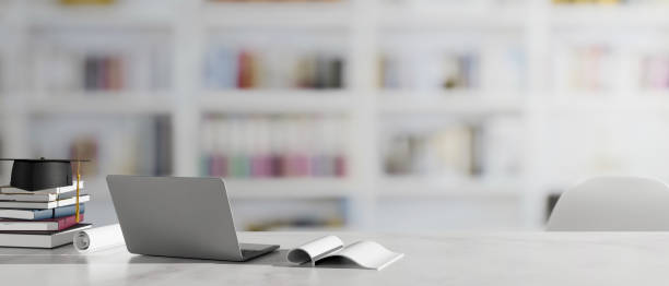 istock Graduation concept, 3D rendering, study table with laptop, books, graduation cap and copy space 1314678073