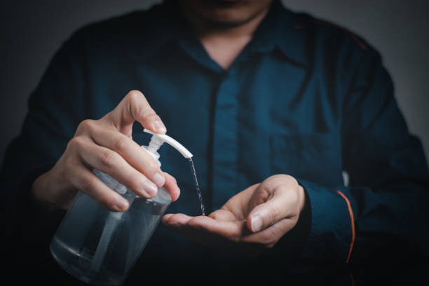 istock A man hand push the gel alcohol for cleaning 1314679474