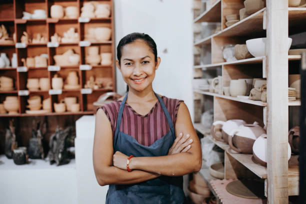 istock Beautiful Young Lady Making Ceramics At Her Workshop 1314679521