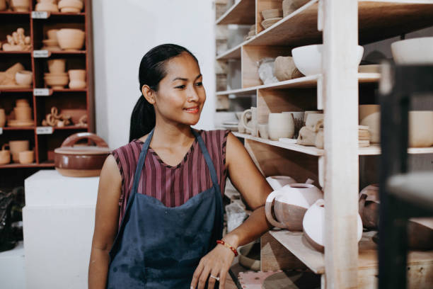 istock Beautiful Young Lady Making Ceramics At Her Workshop 1314679531