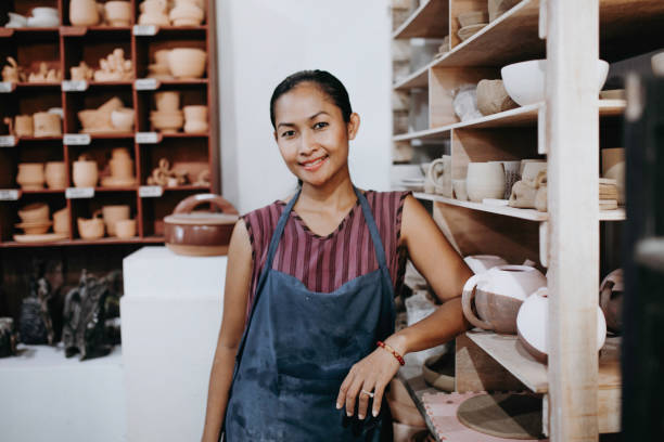 istock Beautiful Young Lady Making Ceramics At Her Workshop 1314679535