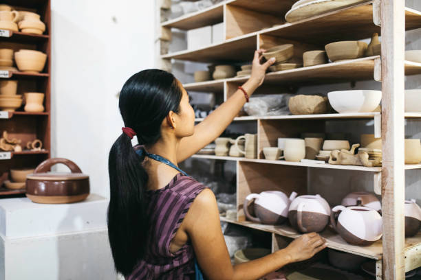 istock Beautiful Young Lady Making Ceramics At Her Workshop 1314679627
