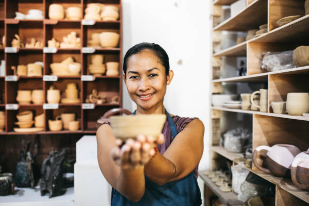 istock Beautiful Young Lady Making Ceramics At Her Workshop 1314679632