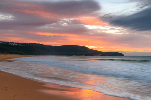 istock Sunrise at the seaside with pastel coloured clouds 1314686727