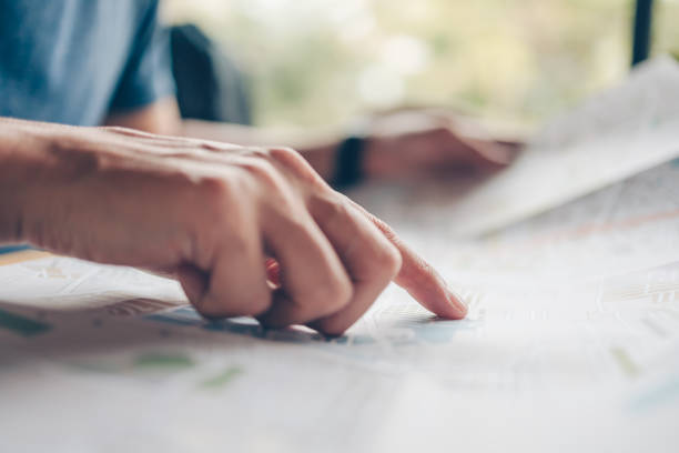 istock Tourist planning vacation pointing with the map. Vocation, travel, holidays and backpack concept. 1314689570