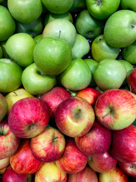 istock Fresh green and red apples on shelf. View from above 1314690531