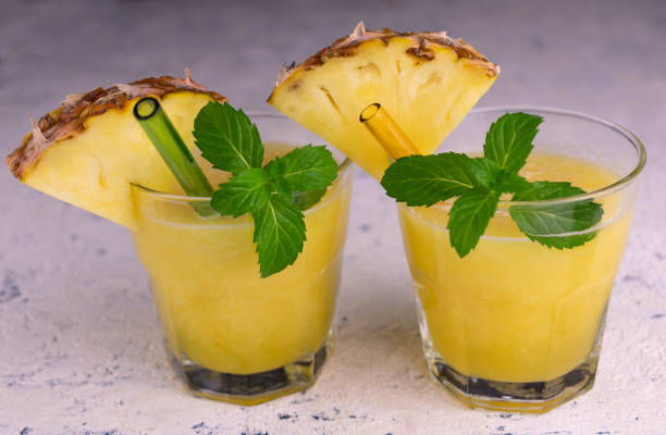 istock Two glasses of pineapple juice on a white background. 1314691665