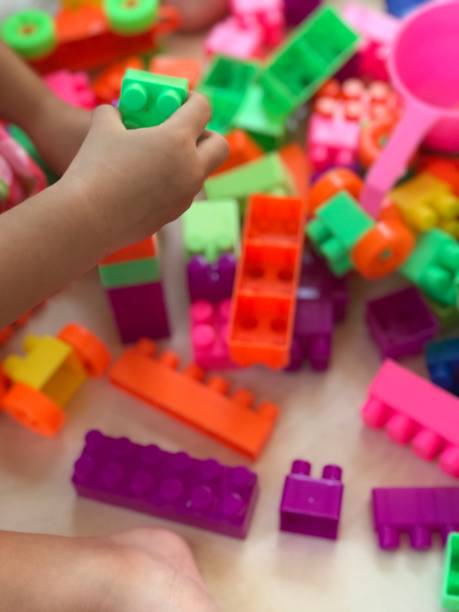istock Little girl playing plastic building blocks 1314694186