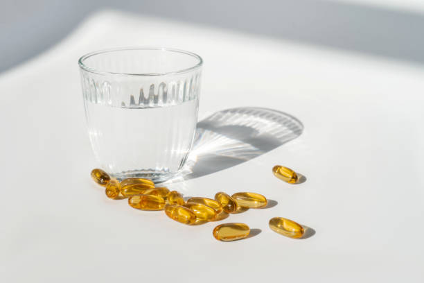 istock Oil filled capsules on the white background 1314695097