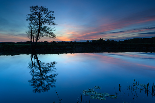 Sunset view across the River Avon with reflections in the water