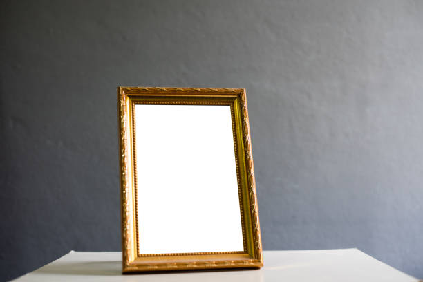 istock Vintage gold fram with white background on gray. 1314698774