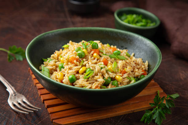 istock fried rice with vegetables in green bowl 1314699817