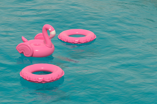 3d rendering of Inflatable Flamingo and Ring on Sea. Summer Holiday Concept. Travel destinations.