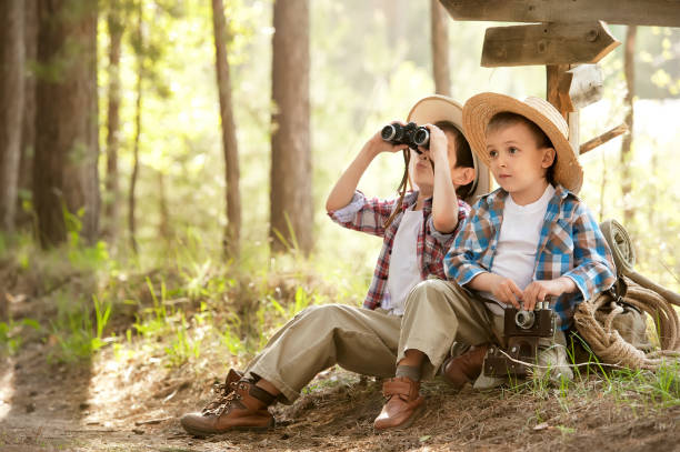 istock Boys on a forest road with backpacks 1314701159