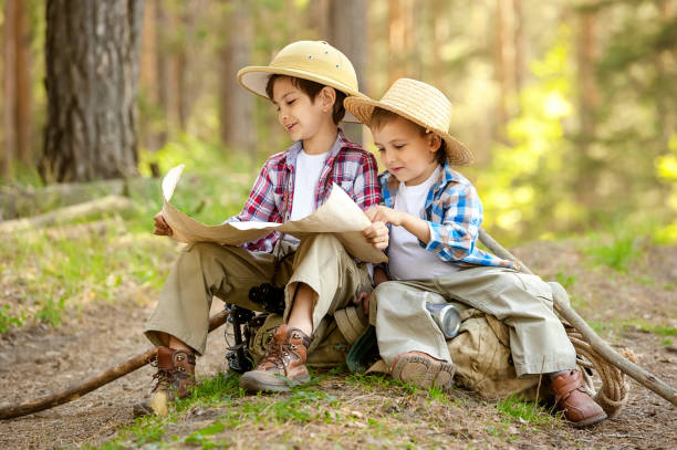 istock Boys on a forest road with backpacks 1314701323
