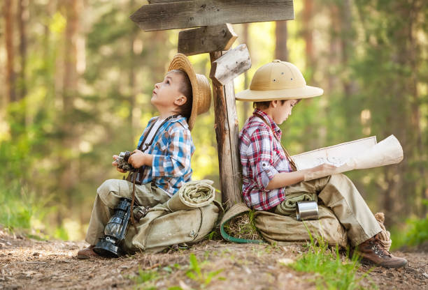 istock Boys on a forest road with backpacks 1314701394