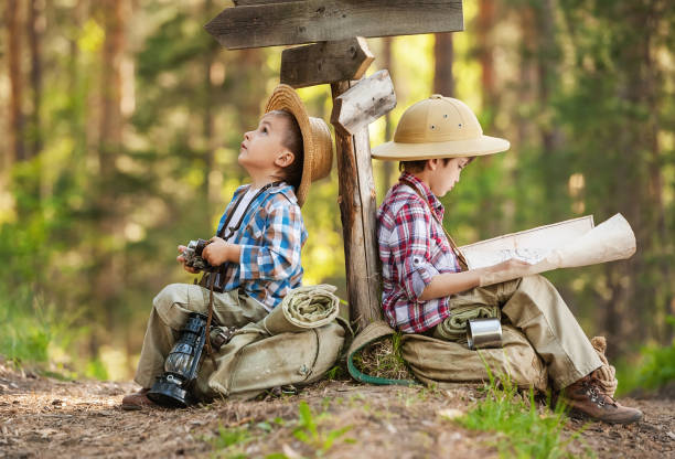 istock Boys on a forest road with backpacks 1314701471