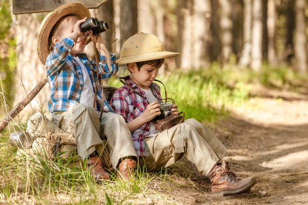 istock Boys on a forest road with backpacks 1314701696