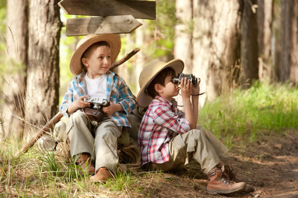 istock Boys on a forest road with backpacks 1314701725