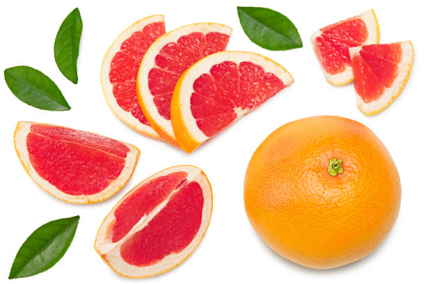 istock grapefruit with slices and green leaves isolated on white background top view. clipping path 1314704850