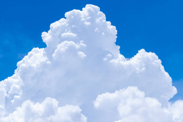 istock White fluffy clouds on blue sky. Soft touch feeling like cotton. White puffy cloudscape. Beauty in nature. Close-up white cumulus clouds texture background. Sky on sunny day. Pure white clouds. 1314706037