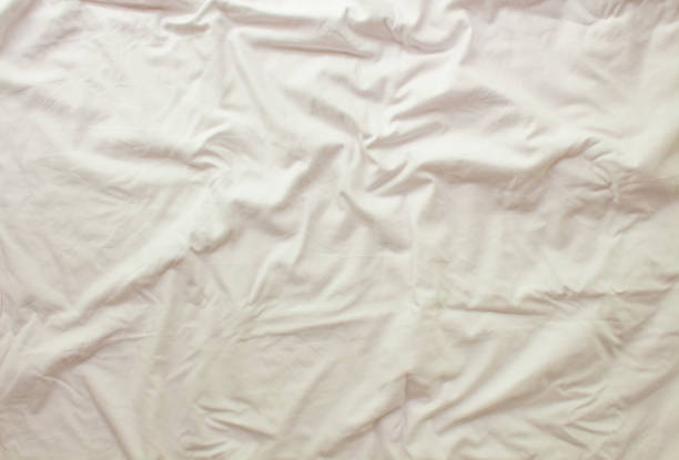 istock Flat layout white background. Modern minimal background with fabric texture and folds of cotton fabric. Top view 1314709071