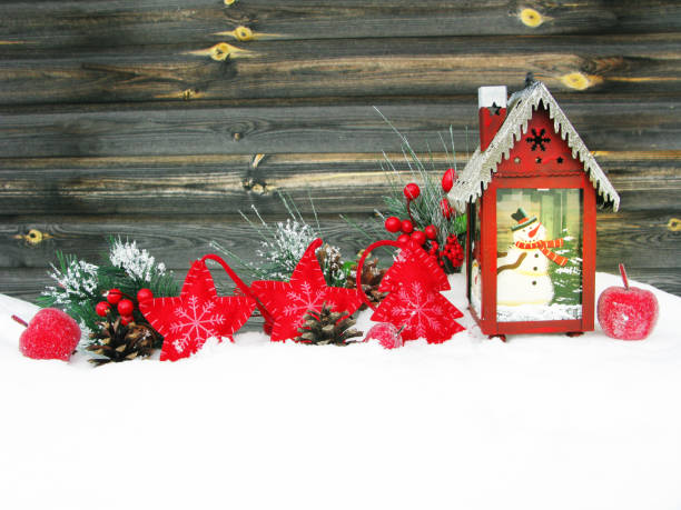 istock christmas lantern fruit berries apple and decoration with fir branches snow 1314714146