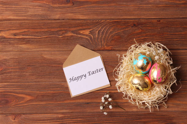 istock Easter composition of painted eggs and feathers on a colored background. 1314714213