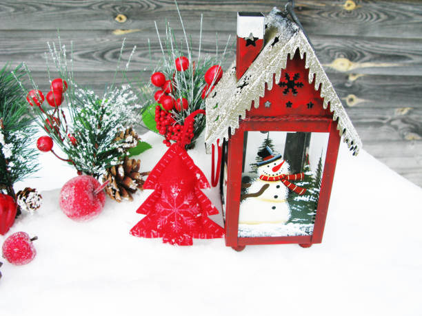 istock christmas lantern fruit berries apple and decoration with fir branches snow 1314714280