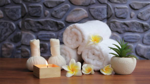 istock Spa accessories,Beautiful composition of spa , spa relax concept,  herbs for massage, beautiful sap set on wood table,Fragrant plumeria flower. 1314716065